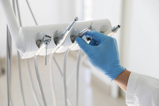 Professional Tooth Extraction technician working in Battle Creek, MI